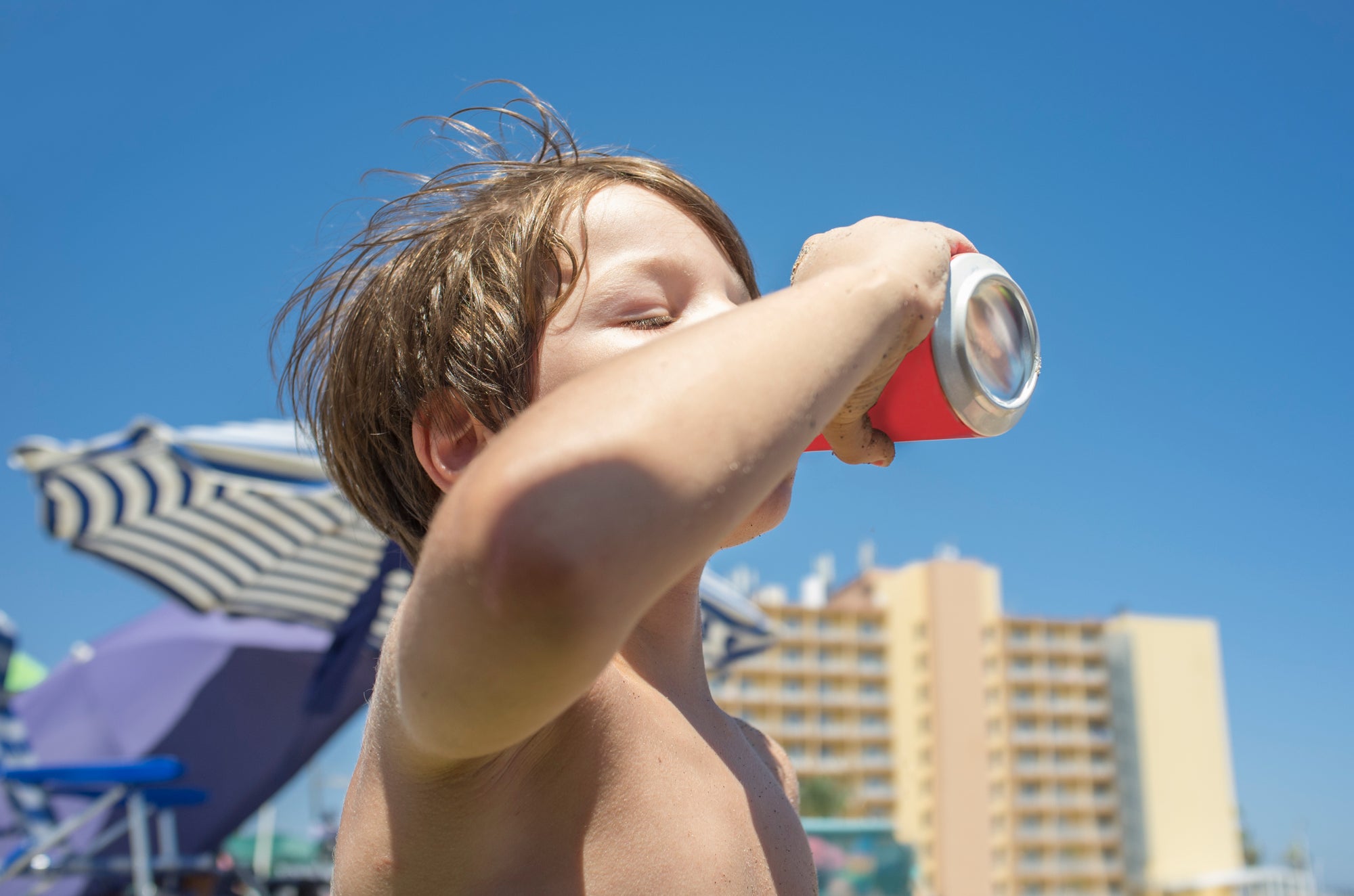 Child drinking from a can