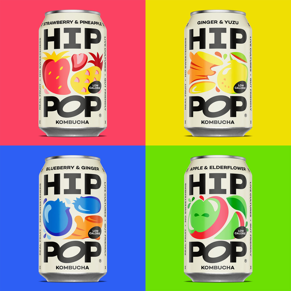 Four cans of HIP POP Kombucha on a grid of red, yellow, blue, and green backgrounds.