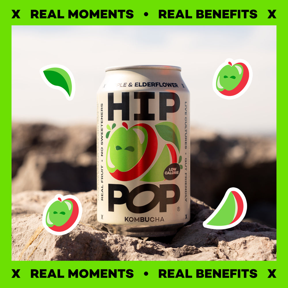 Can of HIP Pop Kombucha on a rock with green elements and text about real moments and benefits.