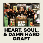 Hip Pop team standing behind a 'HIP POP' branded counter with products displayed.