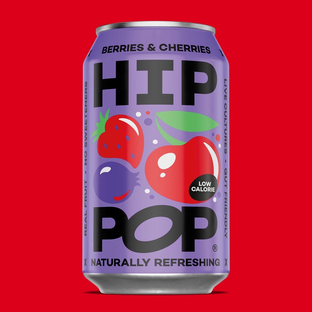 Purple can of HIP POP with berries and cherries on a red background